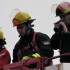 Firefighters taking pictures of the Olympic Flame Relay