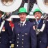 Fire Chief John McKearney, with Dan and Wayne sporting the band's new tubas, standing in front of Ladder 7, preparing for the 2012 St. Patrick's Day Parade, Vancouver.