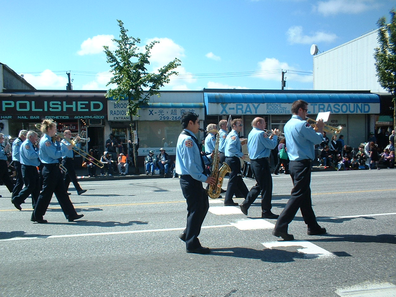 The Vancouver Fire and Rescue Services Band marching in the 2010 Burnaby Hats Off Day Parade down Hastings Street